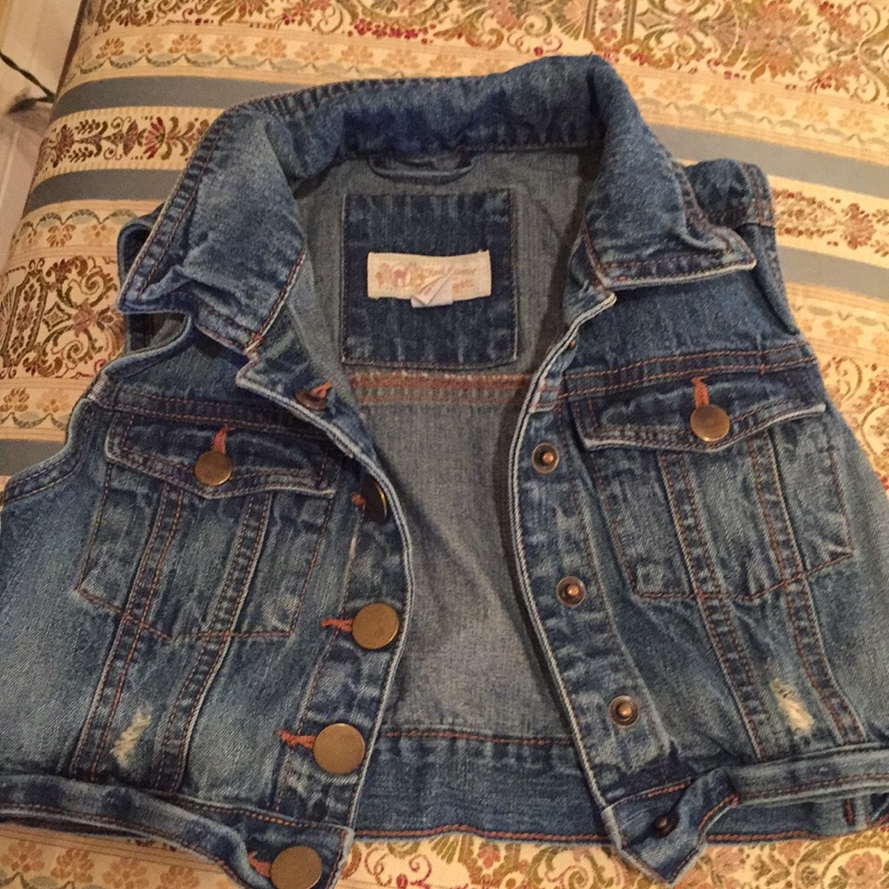 Distressed denim vest